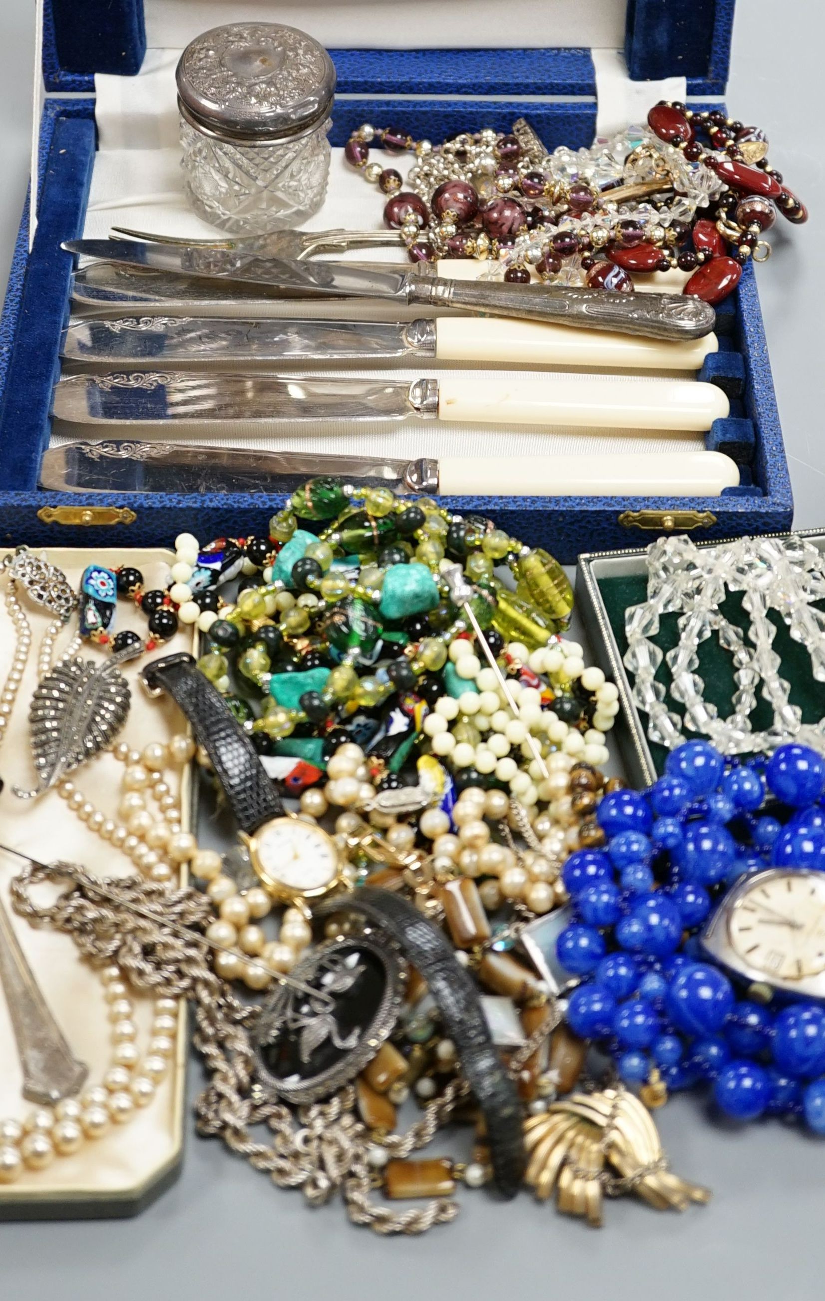 A modern 9ct gold and black onyx spinning fob, a silver ingot pendant, Eternamatic wrist watch, plated flatware and a quantity of assorted costume jewellery.